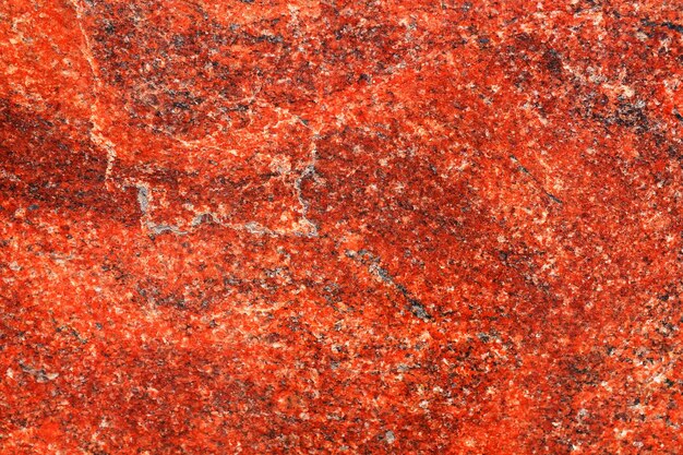 Background of red granite. Template for design. a natural stone