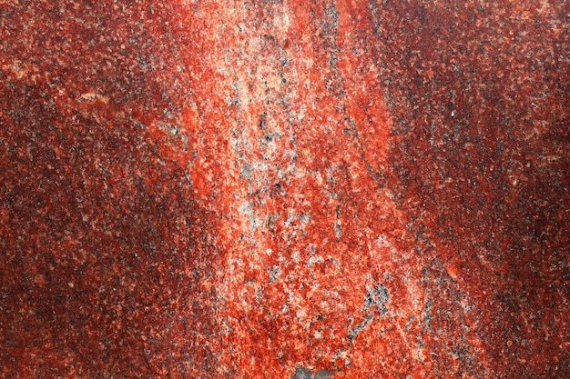 Sfondo di granito rosso. modello per il design. una pietra naturale