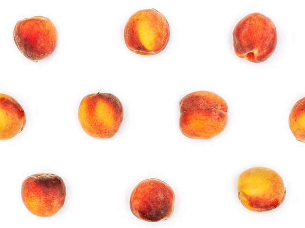 Background of ripe peaches on white