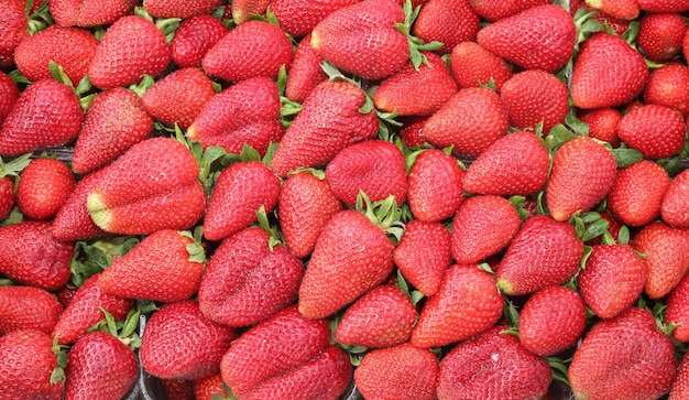 Background of ripe strawberries at local market