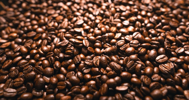 Background of roasted fresh brown coffee beans,Closeup shot of fresh coffee beans-coffee texture