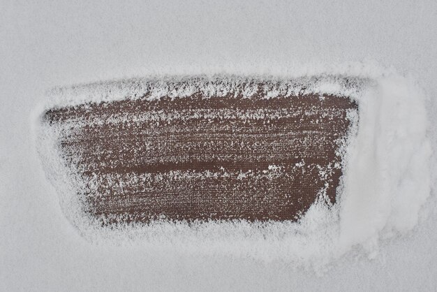 Background. Rusty metal under the snow. Cleared space for text