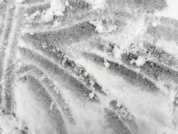 background scratch marks on a thin surface with fluffy snow 