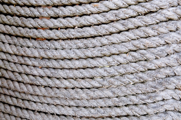 Background of sea ropes laid out in a row closeup