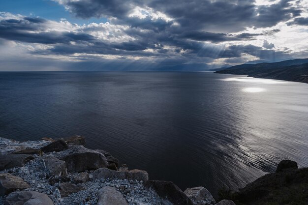 The background of the seascape is heavily cloudy the sea the beach Calm sea or ocean at the bottom of the frame Minimalistic simple background image blue color