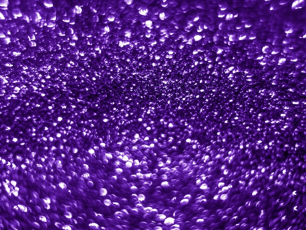 Background sequin. Purple violet sparkle glitter background.