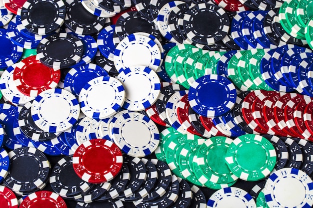 Background of set of colored chips for playing poker