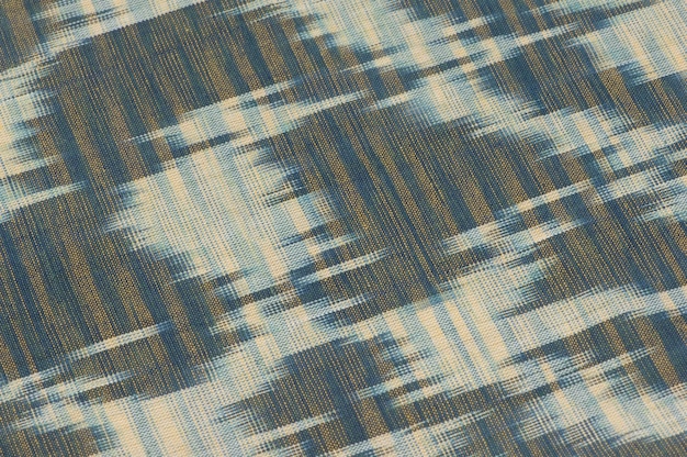 background of silk fabric with oriental ornaments. uzbek silk with ornament