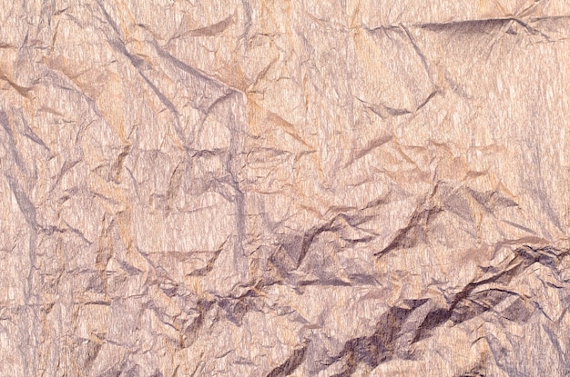 Background of silver and golden wrinkled crepe tissue paper