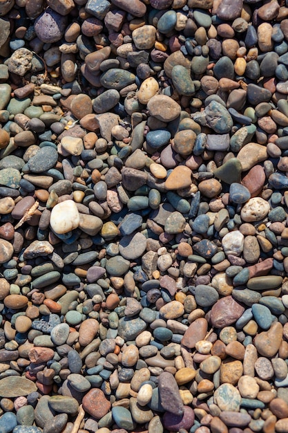 Background of small pebbles and stones on the seashore or in garden