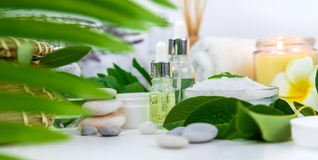 Background spa cosmetics and oils and herbs Selective focus