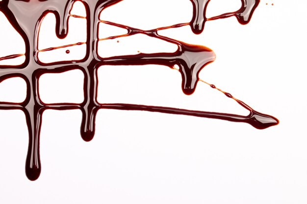 Photo background of splash and flow drops of chocolate