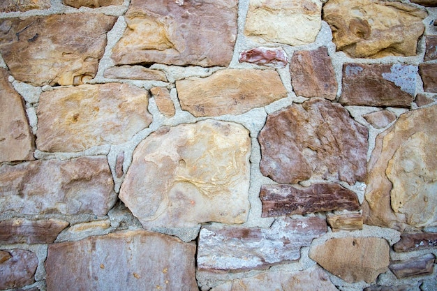 Background of stone wall texture photo. Wallpaper.