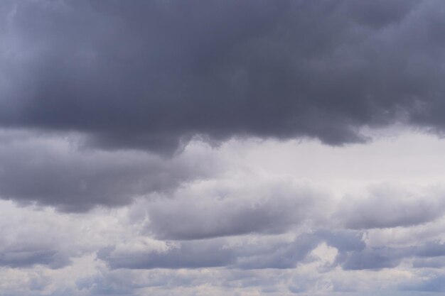 Background, storm clouds illuminated by sunlight.