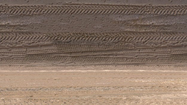 Photo background studio scene of aerial sand with car tire prints