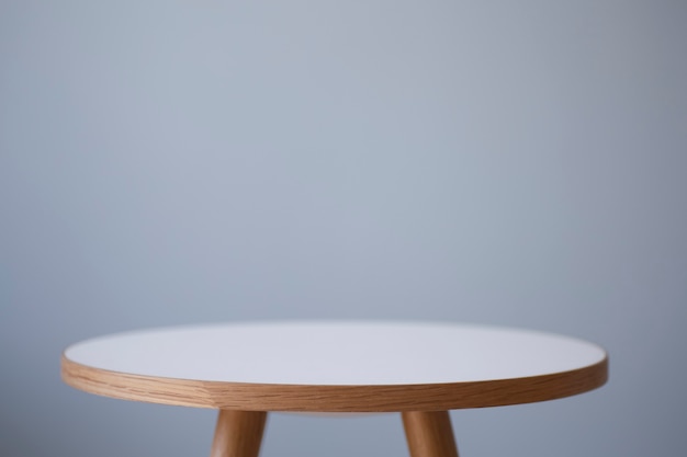 Background table round coffee table in the interior against the
background of a light empty wall