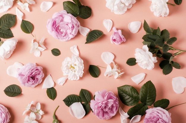 Background of tea roses flowers on a gentle pink