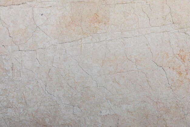 Background and texture of cream colored marble stone with veins