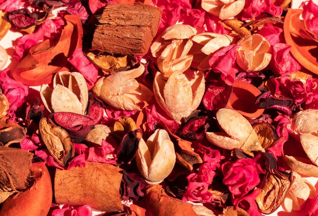 Background and texture of dried flowers, pink, orange and wood