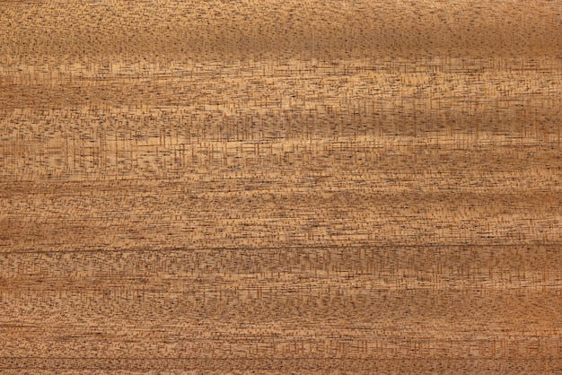 Background, texture of mahogany veneer. Materials for building and furniture industry.