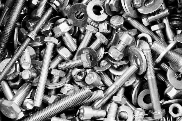 Background texture of nuts and bolts closeup 