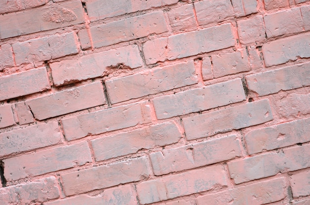 Background texture of old brick wall, painted in pink