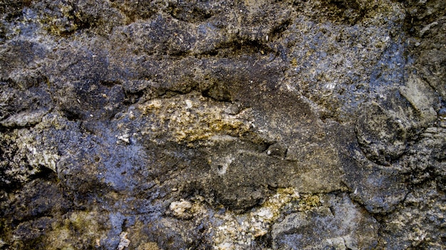 Photo background texture of a pile of stone walls