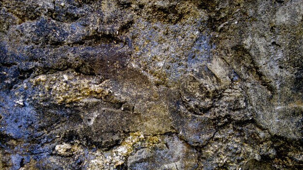 Photo background texture of a pile of stone walls