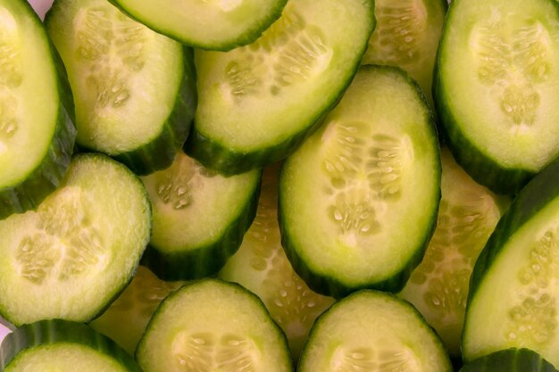 Background texture slices of juicy cucumbers closeup