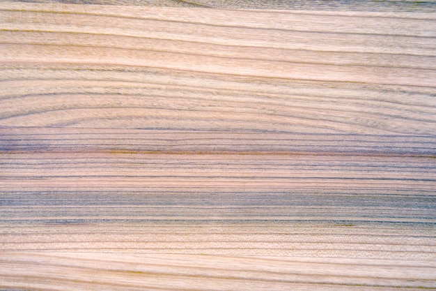 Background and texture of smooth treated wood close-up diagonally.