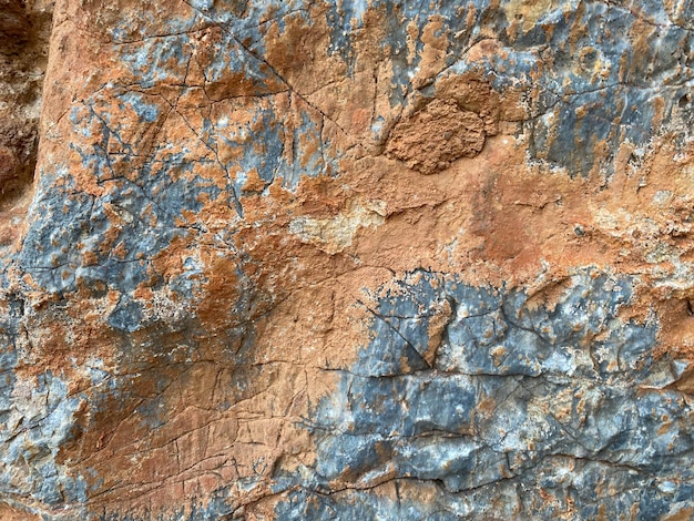 Фон текстура камень натуральный желтый красный поверхность натуральный острый выпуклый грубый булыжник камень