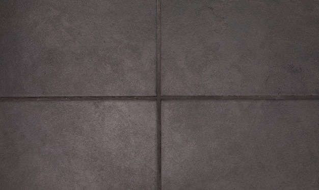 Background texture of textured square floor ceramic tiles.