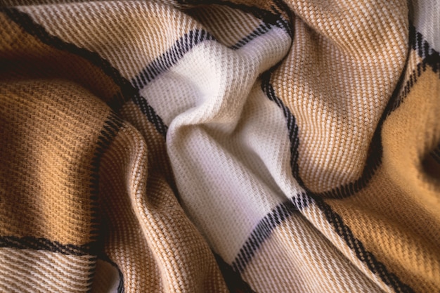 Photo background texture of warm checkered woolen plaid.