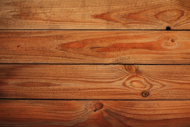 Illuminazione naturale di colore marrone dei bordi di legno di struttura del fondo all'aperto