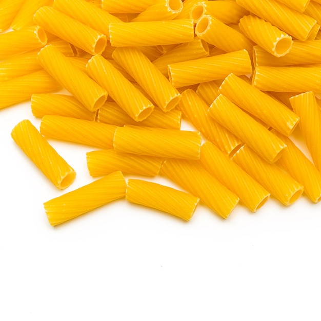 A background of Tortiglioni pasta Noodles isolated on white. Taken in Studio with a 5D mark III.