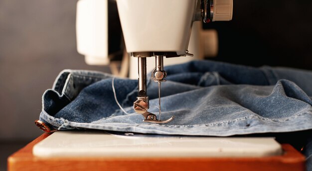 Photo background type of sewing machine, leather belt sewing process. leather workshop.