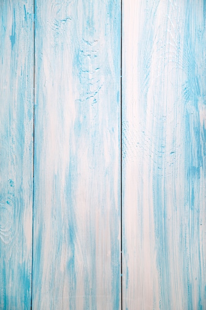 Background of vertically arranged wooden boards of blue color