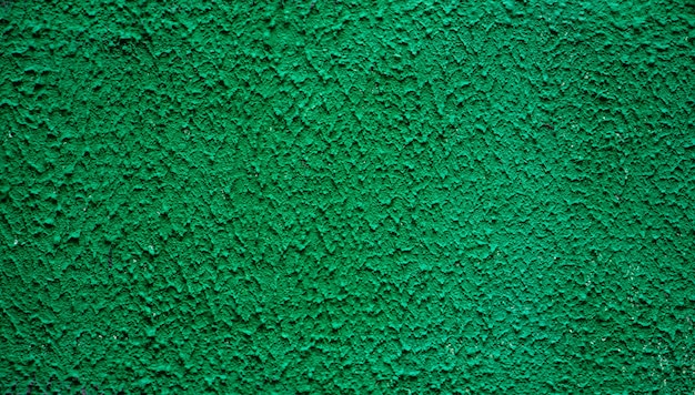 緑の漆喰の背景の壁