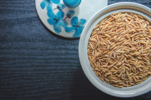 Background and wallpaper by pile of paddy rice and rice seed.