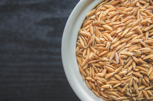 Background and wallpaper by pile of paddy rice and rice seed.