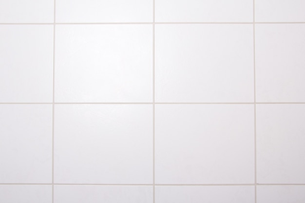 Background of white tiled wall in bathroom