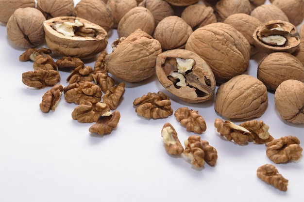 Background of whole and peeled walnuts