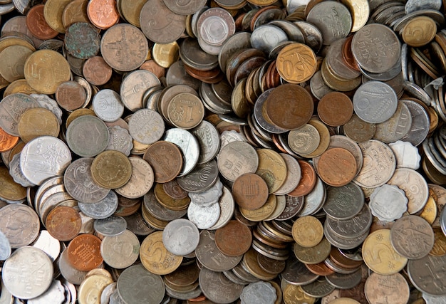 Background with big quantity of coins of different countries