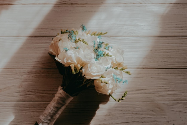 Background with a bouquet of flowers on white wooden boards