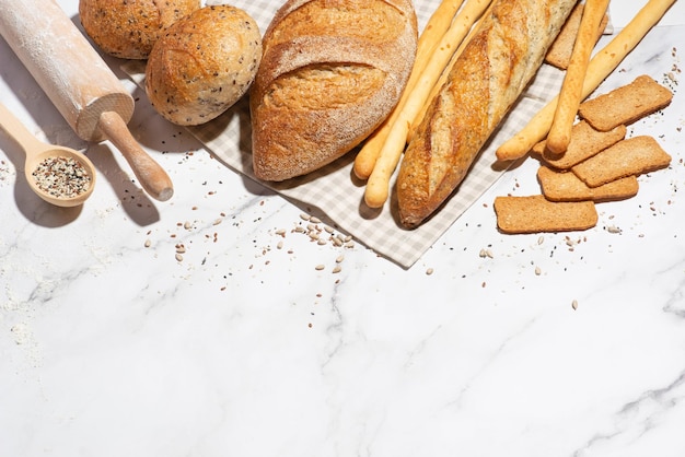 Background with different types of fresh bread Bakery products Cooking