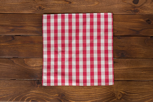 Background with empty wooden table with tablecloth