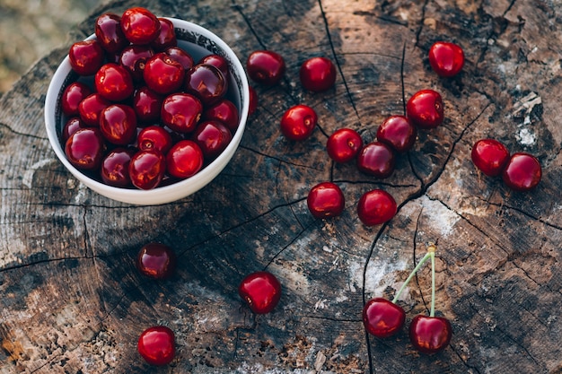 Photo background with sweet cherry on a wooden background