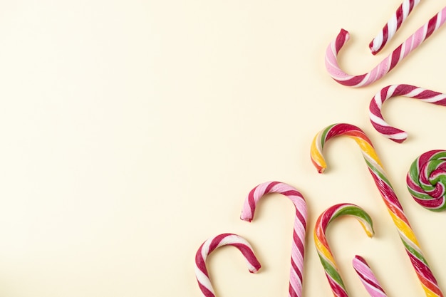 Background with tasty christmas candy canes. Overhead with copy space