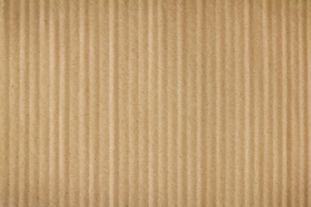 Photo a background with a texture of brown cardboard up close