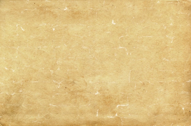 Background with texture of old vintage paper with fibers of fibers and droplets of dirt